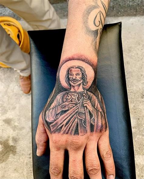 These <strong>tattoos</strong> often incorporate bold, intricate designs that symbolize the wearer’s personal history and heritage. . San judas tattoo on hand